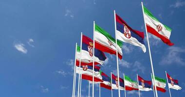 Serbia and Iran Flags Waving Together in the Sky, Seamless Loop in Wind, Space on Left Side for Design or Information, 3D Rendering video