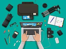 Workspace of photographer. Laptop pc, printer. Modern photo camera, flash, lens and memory card. Professional device for photography. Digital photos and printing. Vector illustration in flat style