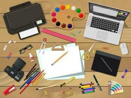 Artist or designer workplace. Painting and drawing supplies. Laptop pc, photo camera, mouse, glasses, pen, printer. Paper blank fo sketch and graphic tablet. Vector illustration in flat style