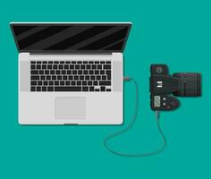 Photo camera plugged to laptop usb port. Import photos from camera to computer. Vector illustration in flat style