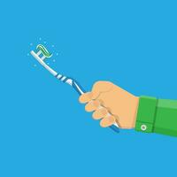 Toothbrush with paste in hand. vector illustration in flat style on blue background