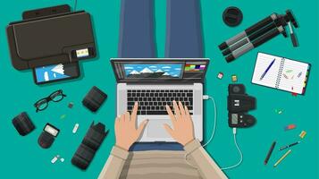 Workspace of freelance photographer. Laptop pc, printer. Photo camera, flash, lens and memory card. Professional device for photography. Digital photos and printing. Vector illustration in flat style