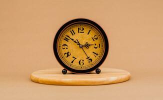 Brown vintage alarm clock Photo of a stationary clock, concept of time and how time works.