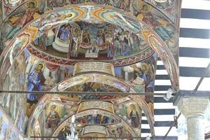 Exterior porches and frescoes of the Rila orthodox monastery photo