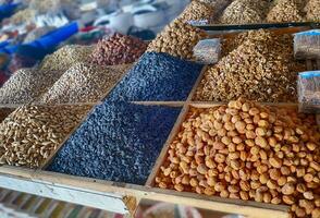 Dried fruit and roasted nuts for sale at the Chorsu market Tashkent photo