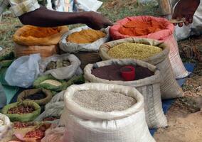 Selling spices at weekly market photo