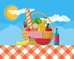 WIcker picnic basket with gingham blanket full of products. Bottle of wine, sausage, bacon, cheese, apple, tomato, cucumber, salad, orange juice. Vector illustration in flat style