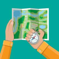 Folded paper city suburban map and compass in hands. Abstract generic map with roads, buildings, parks, river, lake. GPS and navigation. Vector illustration in flat style