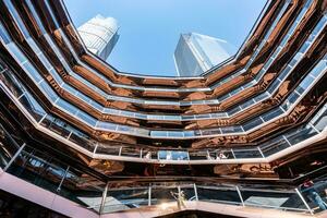 New York City, USA - August 9, 2019-View of the architectural structure called The Vessel in Manhattan during a sunny day photo