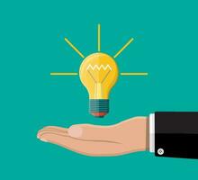 Light bulb. Concept of creative idea or inspiration. Glass bulb with spiral in hand in flat style. Vector illustration