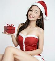 AI generated Santa women cute girl holding a gift on a white background AI generated photo