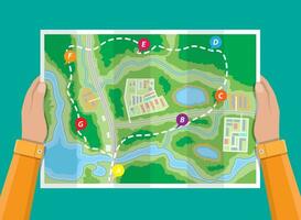 Folded paper city suburban map in hands. Abstract generic map with roads, buildings, parks, river, lake. GPS and navigation. Vector illustration in flat style