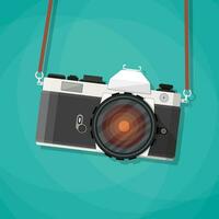 Old vintage photo camera with strap. Hanging retro camera. vector illustration in flat style on green background