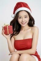 AI generated Santa women cute girl holding a gift on a white background AI generated photo