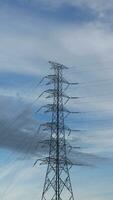 electricity transmission towers against a dramatic sky, symbolizing energy, connectivity, and technological progress photo