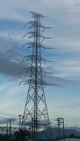 electricity transmission towers against a dramatic sky, symbolizing energy, connectivity, and technological progress photo