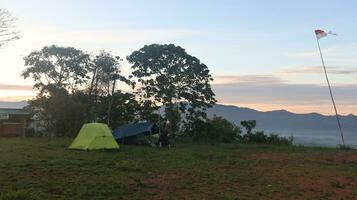 Climber's tent at the top of the mountain. The atmosphere of the camping ground at the top of Mount Arang photo