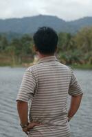 Lake Perintis, Suwawa. Sunny day scenery. Tourists admiring view on popular tourist attraction on Gorontalo, August 27, 2023 photo