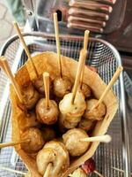 a basket filled with food on sticks photo