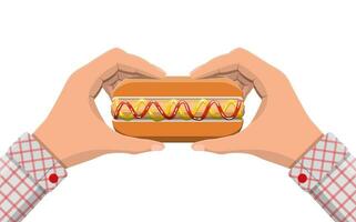 Hotdog in hands. Sausage with bun, mustard and ketchup. Fast food concept. Vector illustration in flat style