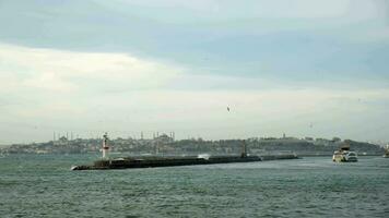 Big waves are hitting and splashing over the jetty in Istanbul in slow motion video