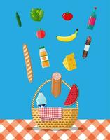 WIcker picnic basket with gingham blanket full of products. Bottle of wine, sausage, bacon, cheese, apple, tomato, cucumber, salad, orange juice. Vector illustration in flat style