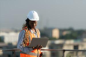Engineer working on a building site The telephone and internet network signal systems of the construction building are being inspected. photo