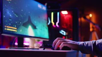 Close up shot of man using gaming rgb lit mouse to play entertaining videogame, flying spaceship through galaxy. Pro gamer using professional computer peripherals to enjoy science fiction game video