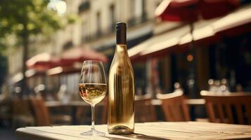 AI generated Generative AI, glass of white wine and bottle on wooden table with blur background with lights of street bar, cafe, coffee shop or restaurant, wine mock up photo