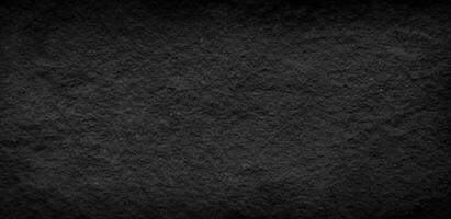 Dark grey black slate stone background or texture photo