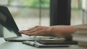 Business team working with new startup project plan and discussion information for financial strategy with laptop and digital tablet in a modern business lounge. video