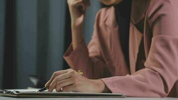 Beautiful female call center operator working on computer in office video