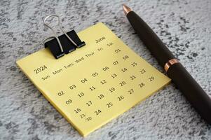 June 2024 calendar on sticky notes. Calendar concept. photo