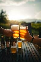 Beer on the table and camping party,hands toasting in beer, photo