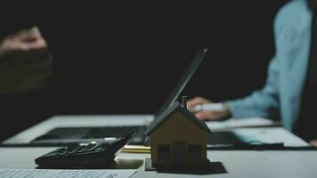 Real estate broker agent being analysis and making the decision a home estate loan to customer to signing contract documents for realty purchase, Bank employees recommend mortgage loan approval. video