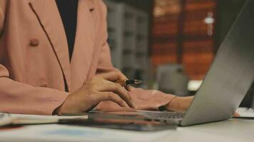 Business team working with new startup project plan and discussion information for financial strategy with laptop and digital tablet in a modern business lounge. video