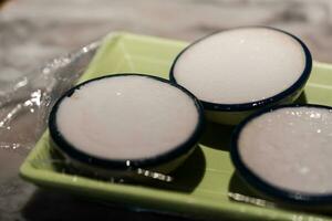 Steamed pandan and coconut milk cake. Thai dessert photo