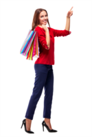 Portrait of young happy smiling pretty woman with shopping bags pointing on something by a finger, isolated png