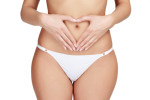 Woman's hands forming a heart symbol on the belly, isolated png