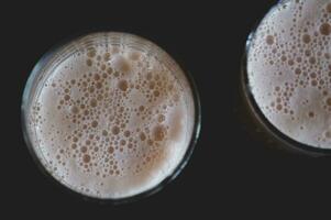 Glass of fresh lager beer with bubble foam. photo