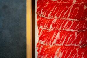 Premium raw sliced beef. photo