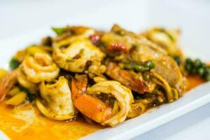 Stir fried spicy and delicious seafood photo