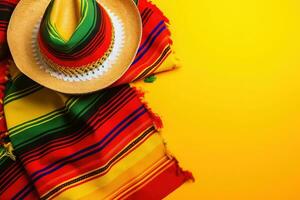 AI generated mexican hat and colorful scarf on yellow background photo