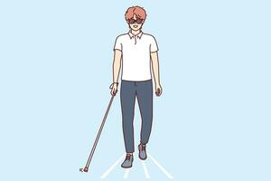 Young blind man walks through city wearing sunglasses and using cane to find way. vector