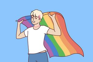 LGBT guy holds rainbow flag, openly announcing sexual orientation and participating in pride month vector