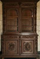 Old vintage wardrobe furniture with ornamental doors and retro colors of wooden surfaces photo