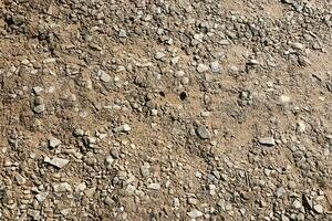 Background of shattered stony stones surface in mountain area. Texture with natural light photo