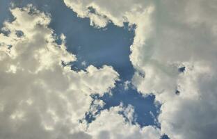 Beautiful blue sky background template with some space for input text message below isolated on blue photo