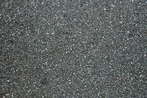 Surface grunge rough of asphalt. Tarmac dark grey grainy road. Texture Background Top view photo