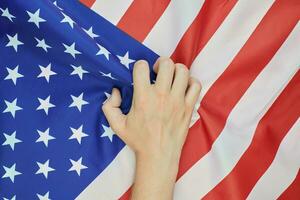 Hand crumpled national USA american flag photo